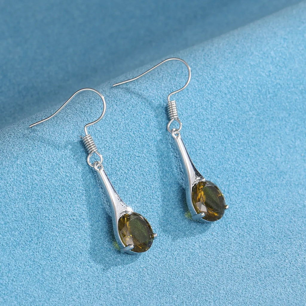 Women's olive green topaz coloured drop earrings with a simple water drop shape and retro style.
