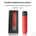 Portable desktop nozzle dust and debris cleaner handheld vacuum on desk surface