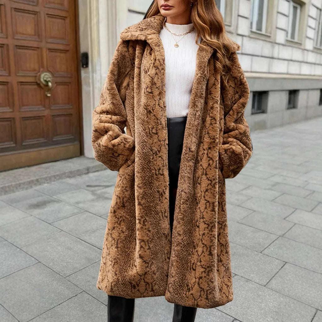 A woman wearing a thick brown leopard print faux fur coat with an over-the-knee length.