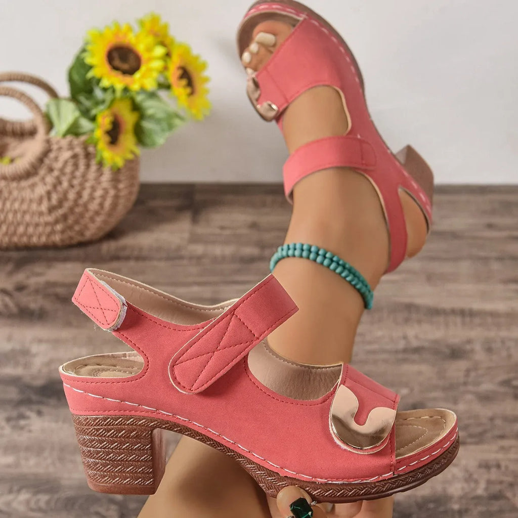Light brown Velcro-strap Roman sandals with a round toe and rubber sole on a white background