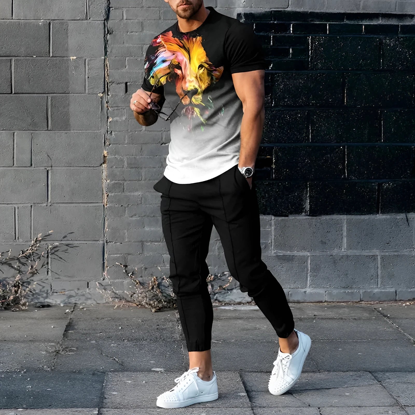 Man wearing a printed short-sleeve T-shirt and matching trousers from a polyester sports set.