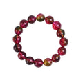 Handmade women's bracelet with red and green watermelon crystal beads on a string.
