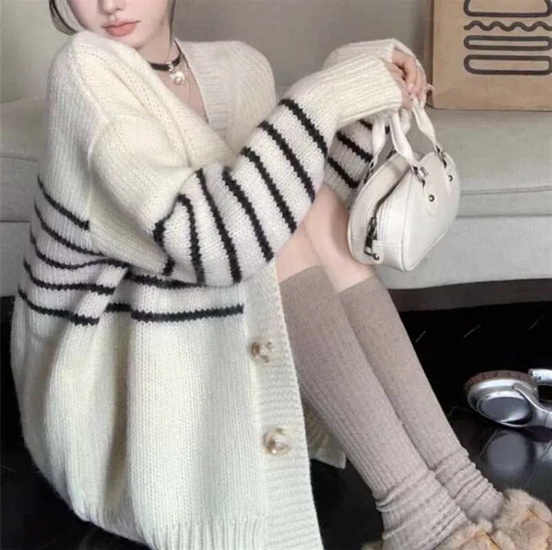 Women's button-down cardigan sweater with a 3D texture pattern in a casual style.