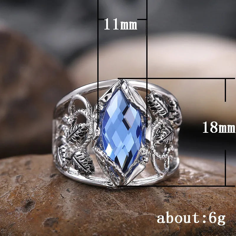 Blue crystal horse eye geometric ring on alloy band showing side profile