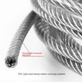 Coiled 304 stainless steel anti-theft security cable with coated finish on a grey background.