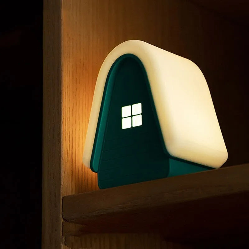 Polar Species igloo baby night light in blue with silicone shade showing touch dimmer and USB cable