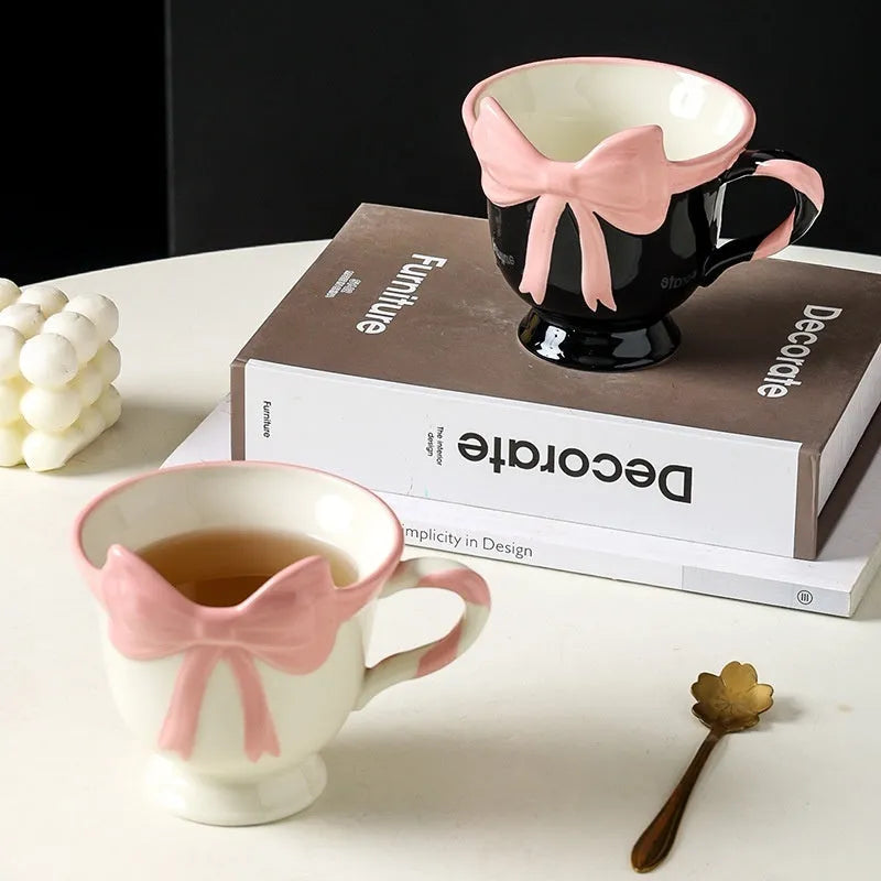 Ceramic mug with heart and bow design in Black Pink colour, showing 301-400ml capacity.