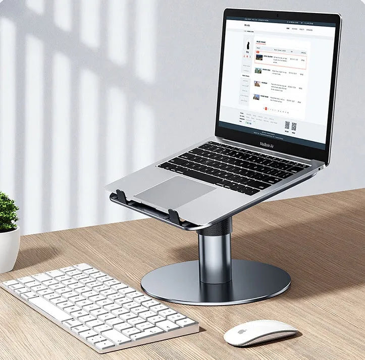 Silver aluminium car laptop stand shown at an adjusted height on a surface.