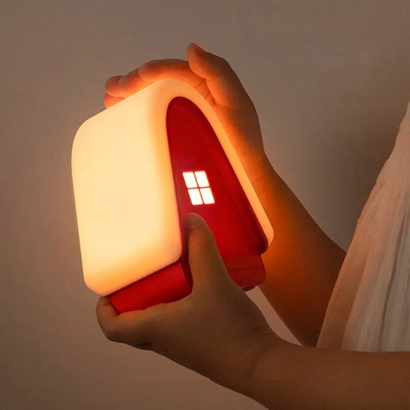 Polar Species igloo baby night light in blue with silicone shade showing touch dimmer and USB cable