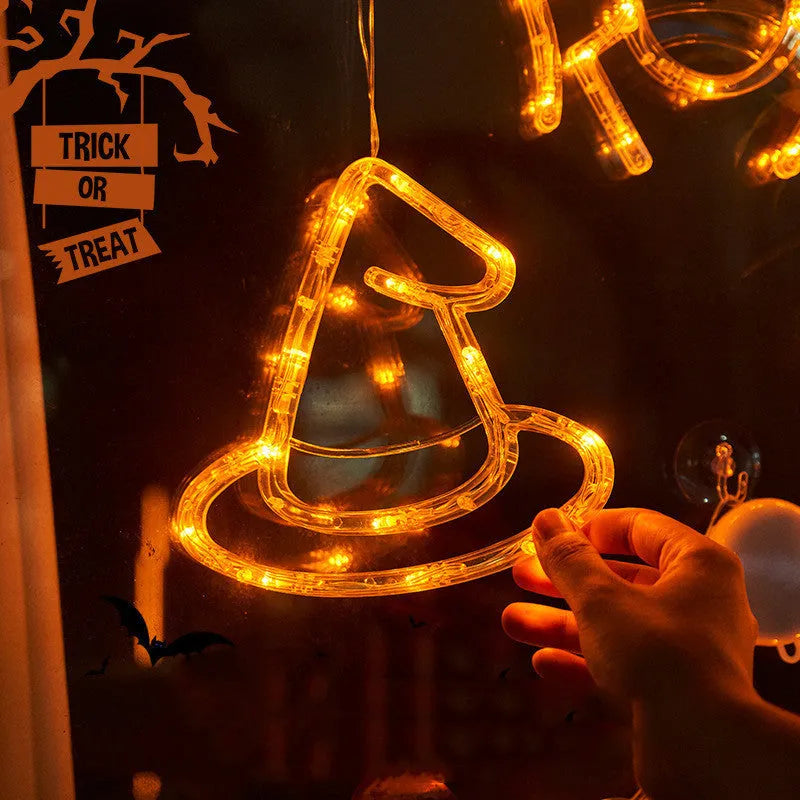 Halloween window hanging LED lights 7-piece set with spider pumpkin ghost designs on display