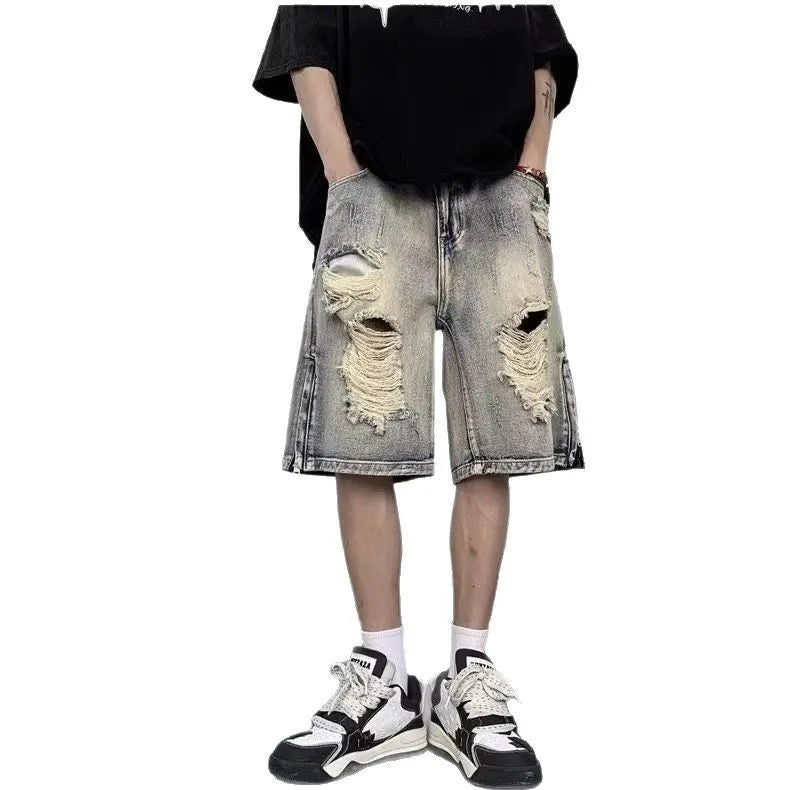 Blue retro tattered denim shorts with wide leg fit and distressed detailing