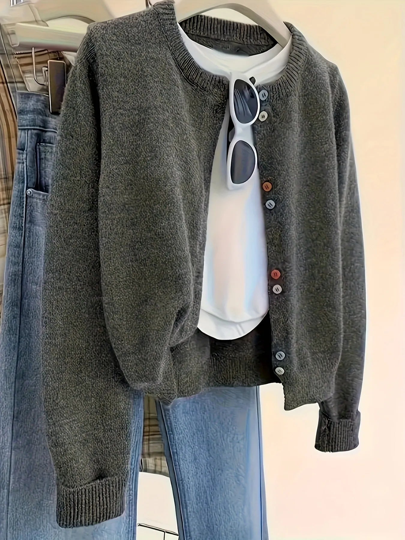 Dark grey women's cardigan sweater with button front and long sleeves