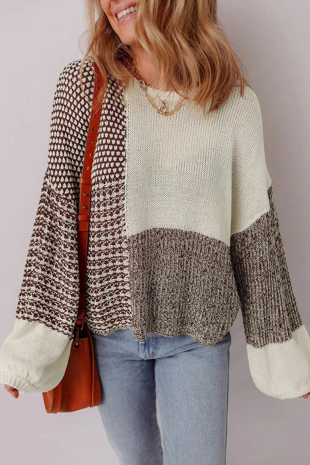 Dark khaki loose sweater with drop shoulders, colour block pattern, and a tie at the back.