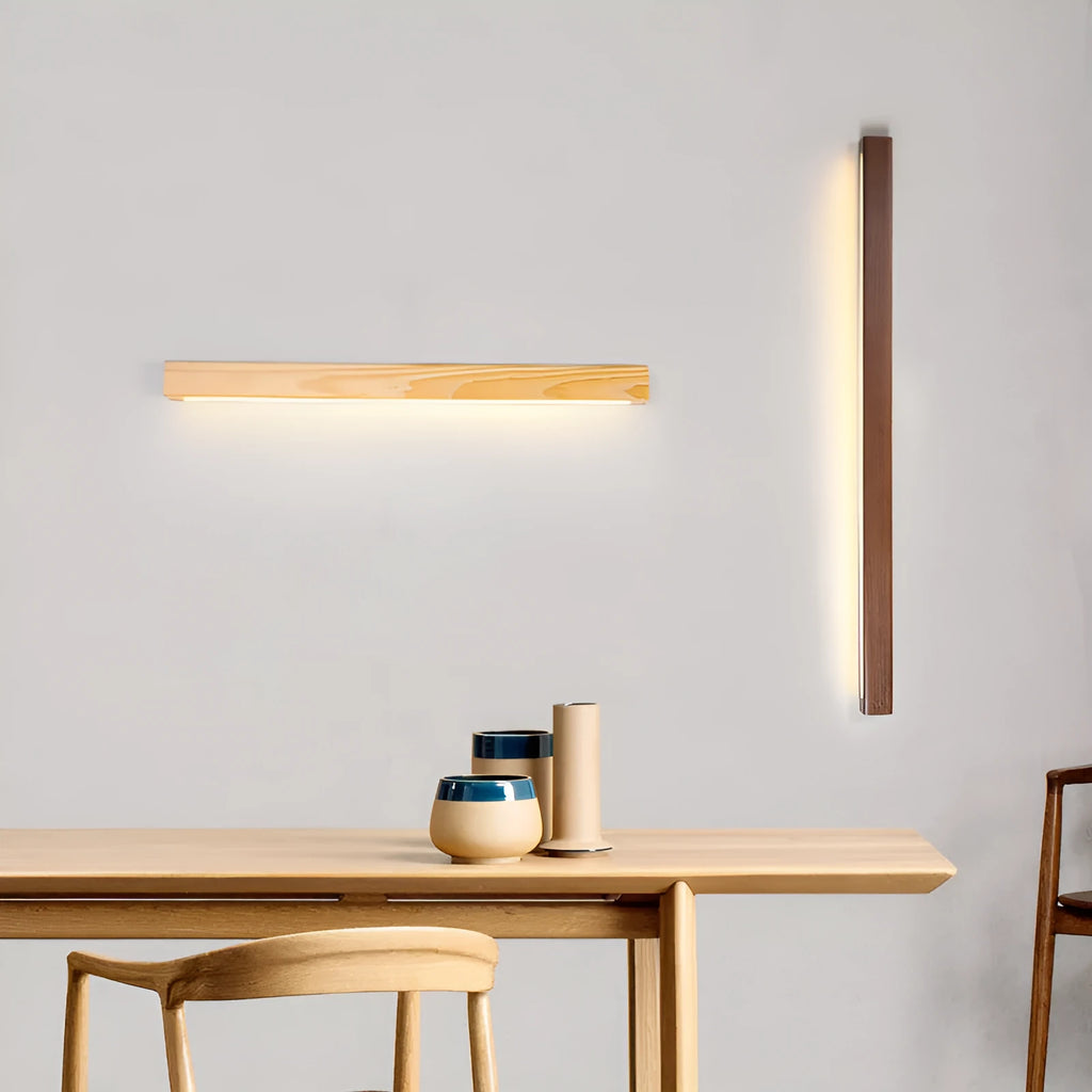 Walnut-coloured wood and acrylic linear LED strip wall lamp in a modern minimalist style.