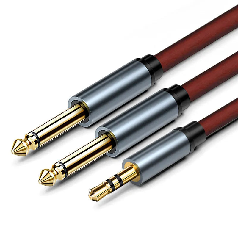 3.5mm stereo plug to two 6.35mm plug audio cable on a grey background