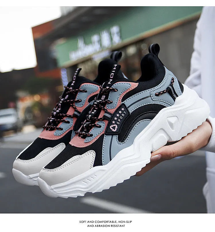 Women's white casual sports shoes with mesh upper, thick PU sole, buckle detail, and round toe.