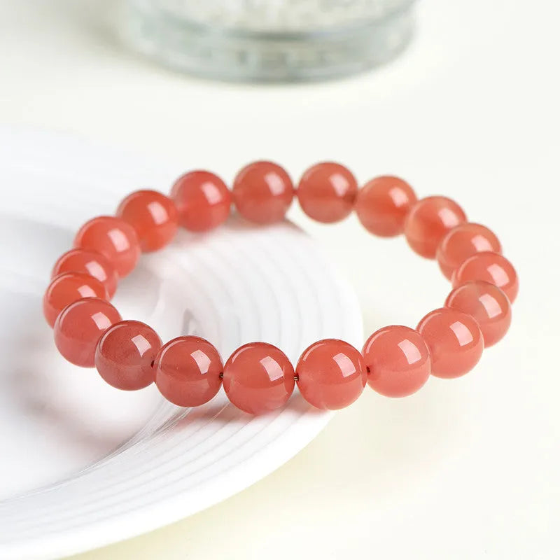 Natural Cherry Red Agate bracelet with polished beads, shown in a single circle configuration.