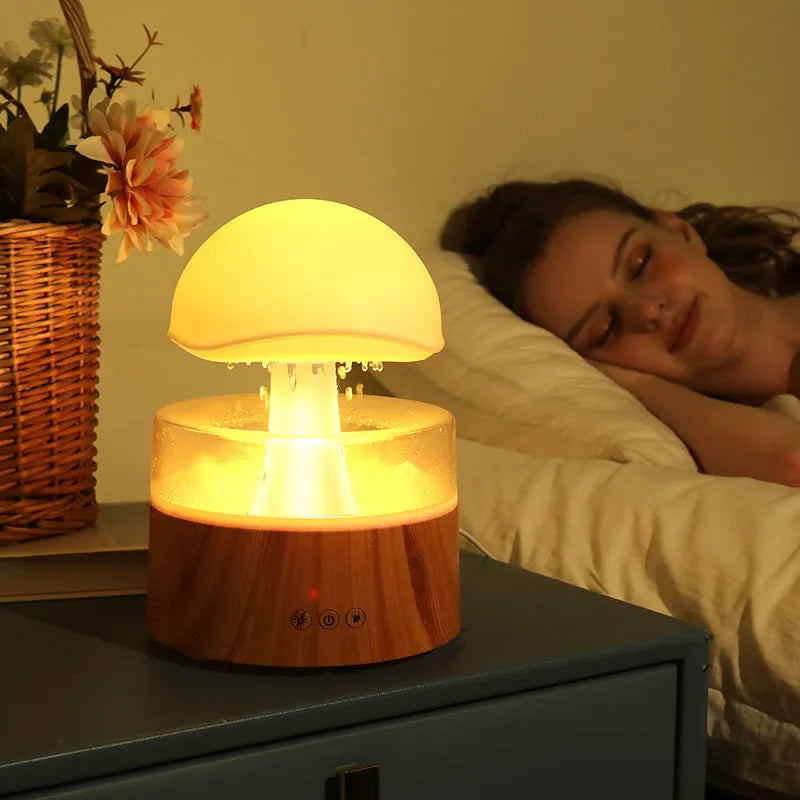White rain cloud shaped humidifier and aroma diffuser with LED lighting and rainfall simulation