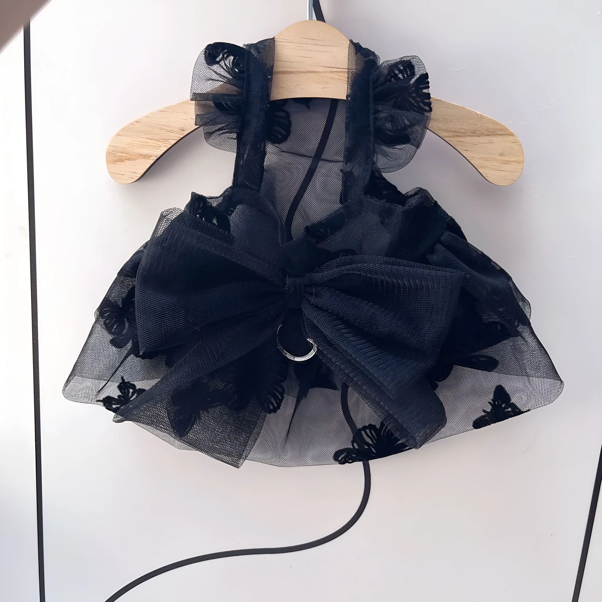 Black tulle princess skirt costume on a small dog, showing the gauze material and fit.