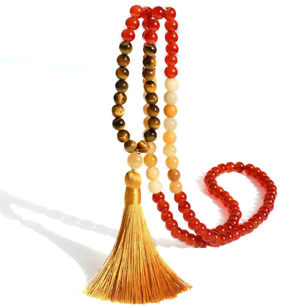 Long bohemian necklace with 108 stone tassels and a geometric gemstone pendant on an 81cm chain.