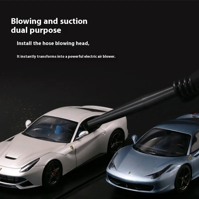 Portable desktop nozzle dust and debris cleaner handheld vacuum on desk surface