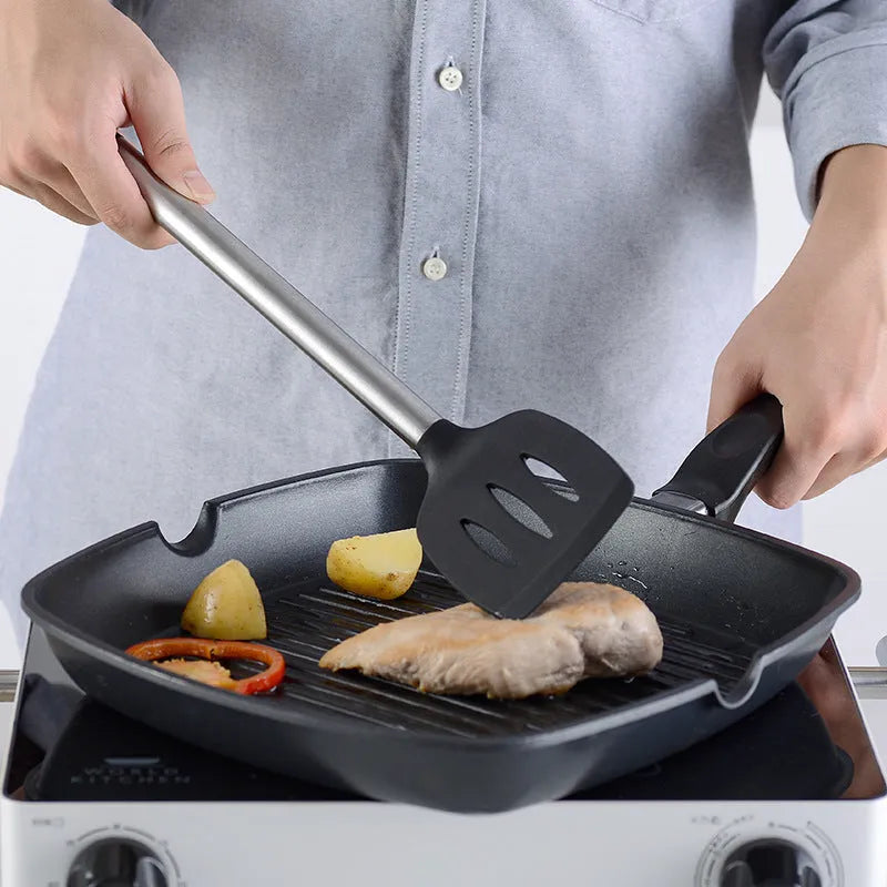 16-piece black silicone and stainless steel kitchen utensil set including spatulas and spoons.