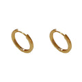 Gold and silver geometric round ear clip earrings for women on a simple background.