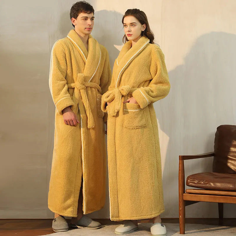 Man and woman wearing a matching thick flannel couple's bathrobe set in a winter colour.