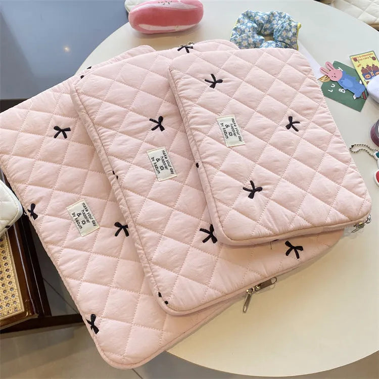 Cute rhombus embroidered bow laptop sleeve in light blue colour, zipper closure.