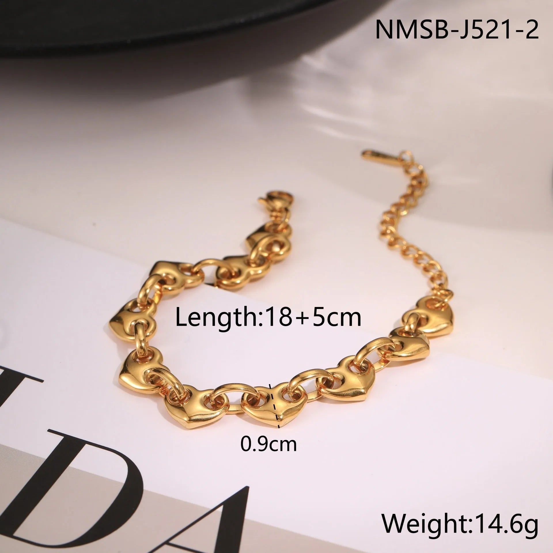 Women's stainless steel bracelet with a hollowed-out geometric heart charm in a gold-plated finish.