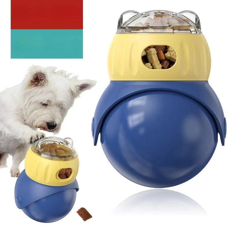 Yellow and blue plastic tumbler-style cat feeder puzzle toy on a floor.