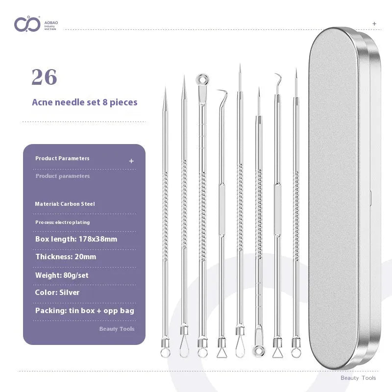 Four silver metal acne needles with pointed tips laid out on a surface.