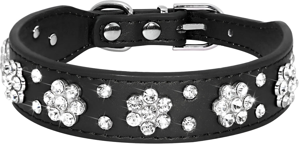 A pink PU leather dog collar studded with silver rhinestone flowers and a metal D-ring.