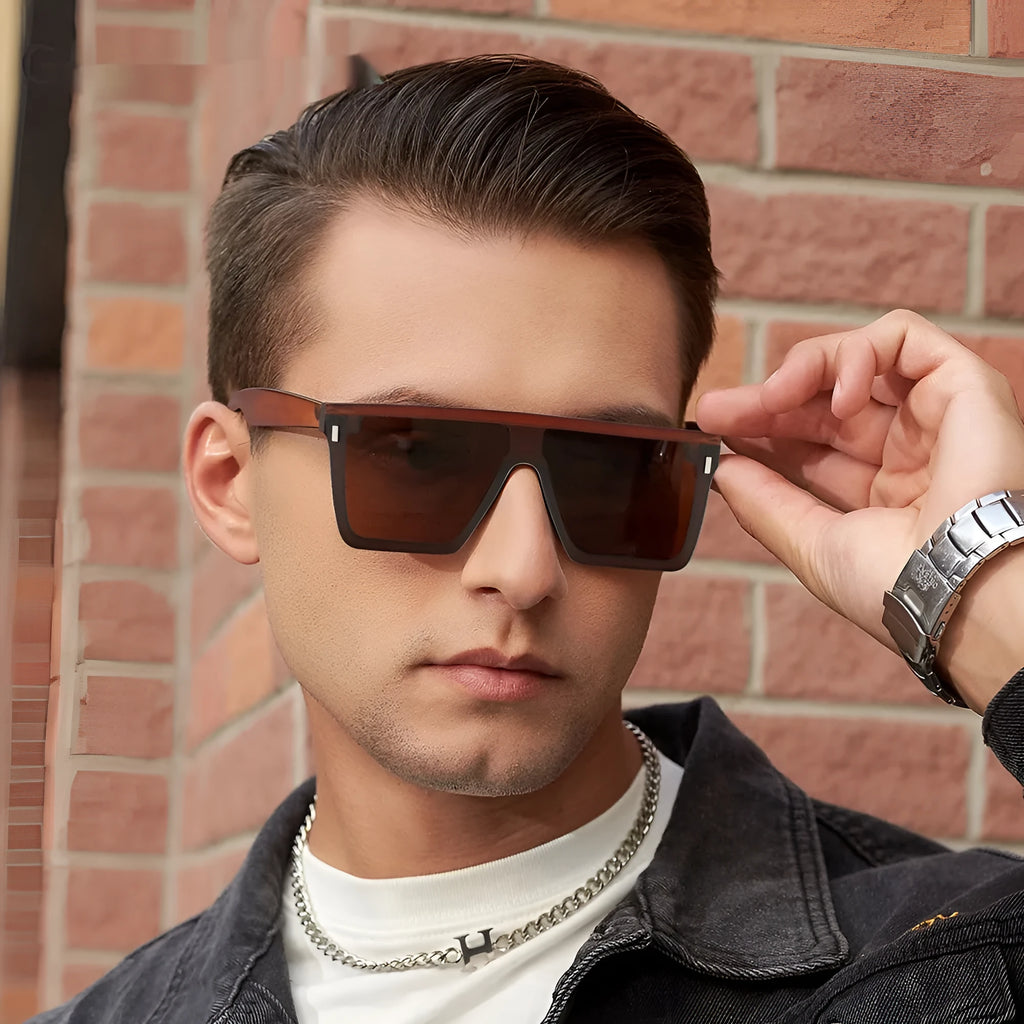 Polarised sunglasses in sand black frame with grey lenses, suitable for outdoor sports and fashion.