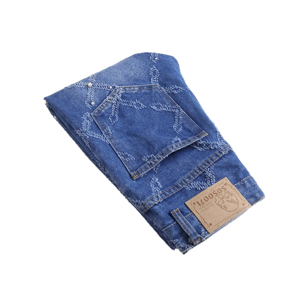Pearl embroidery street trendy denim skinny pants in blue with mid-rise tapered leg and embroidered pearl details.