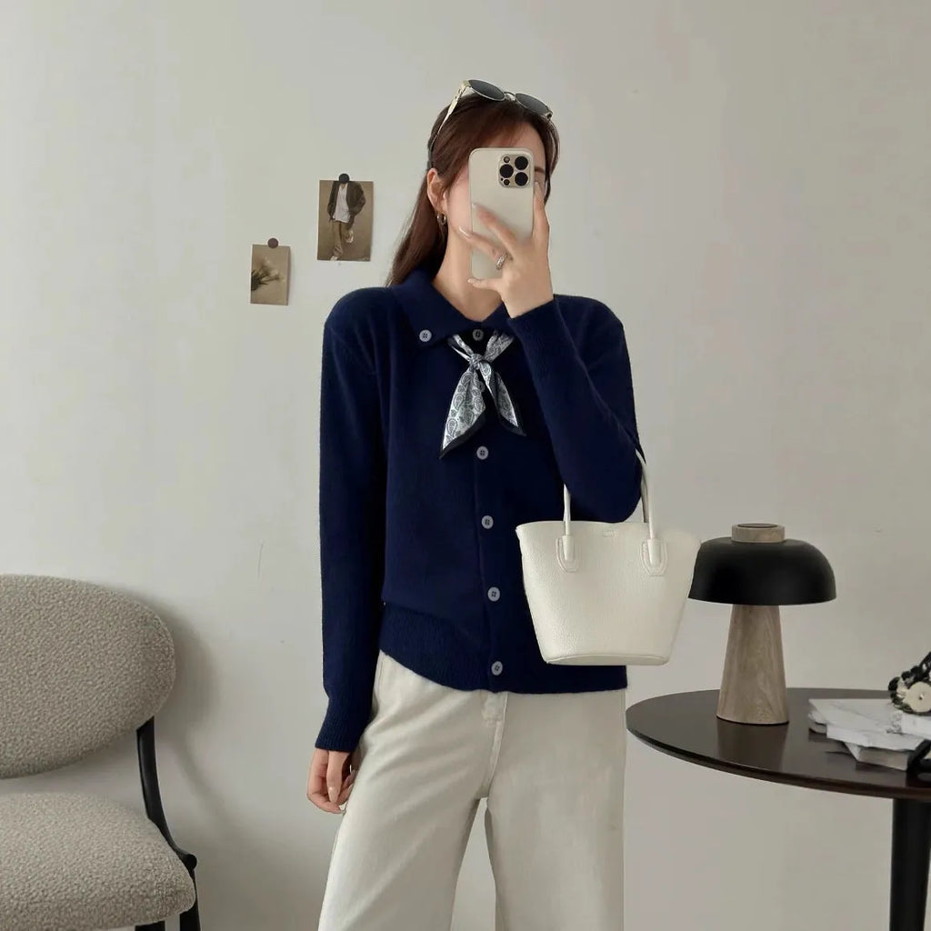 Milky white lazy fashion lapel scarf cardigan sweater with splicing detail and long sleeves.
