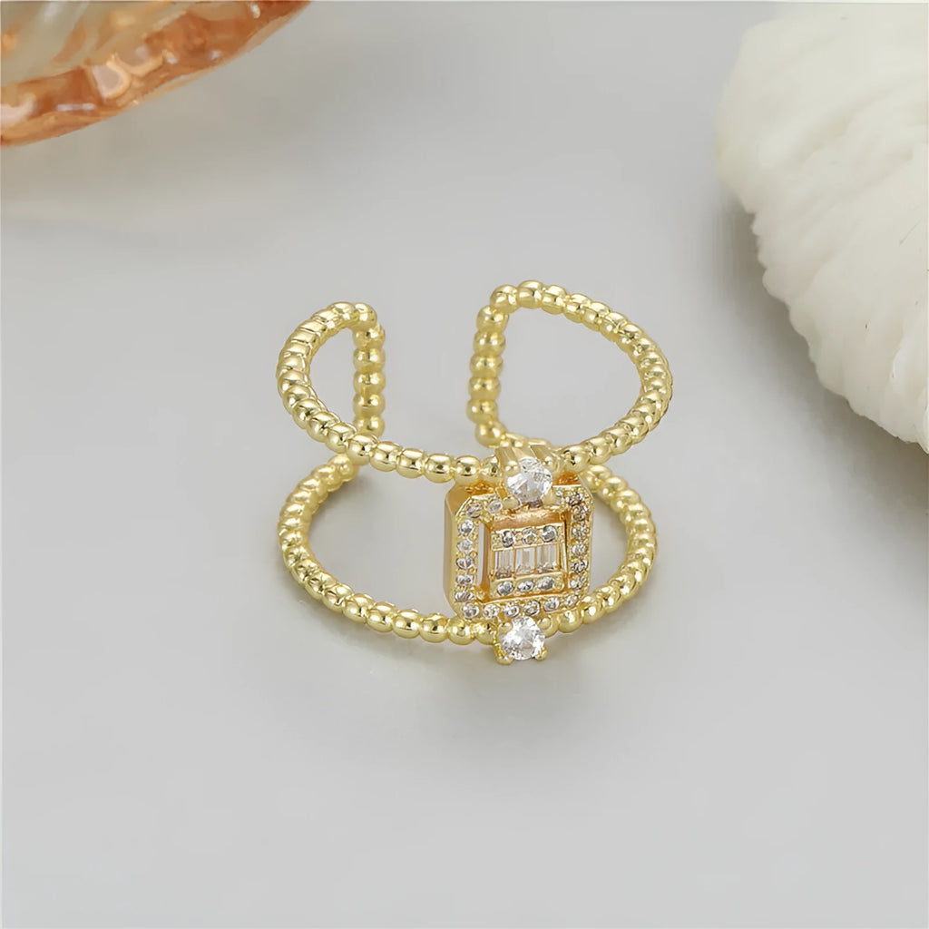 Copper adjustable open ring with asymmetric U-shape and gold colour finish
