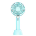 Blue handheld and desktop mini USB fan with oscillation function on a table.