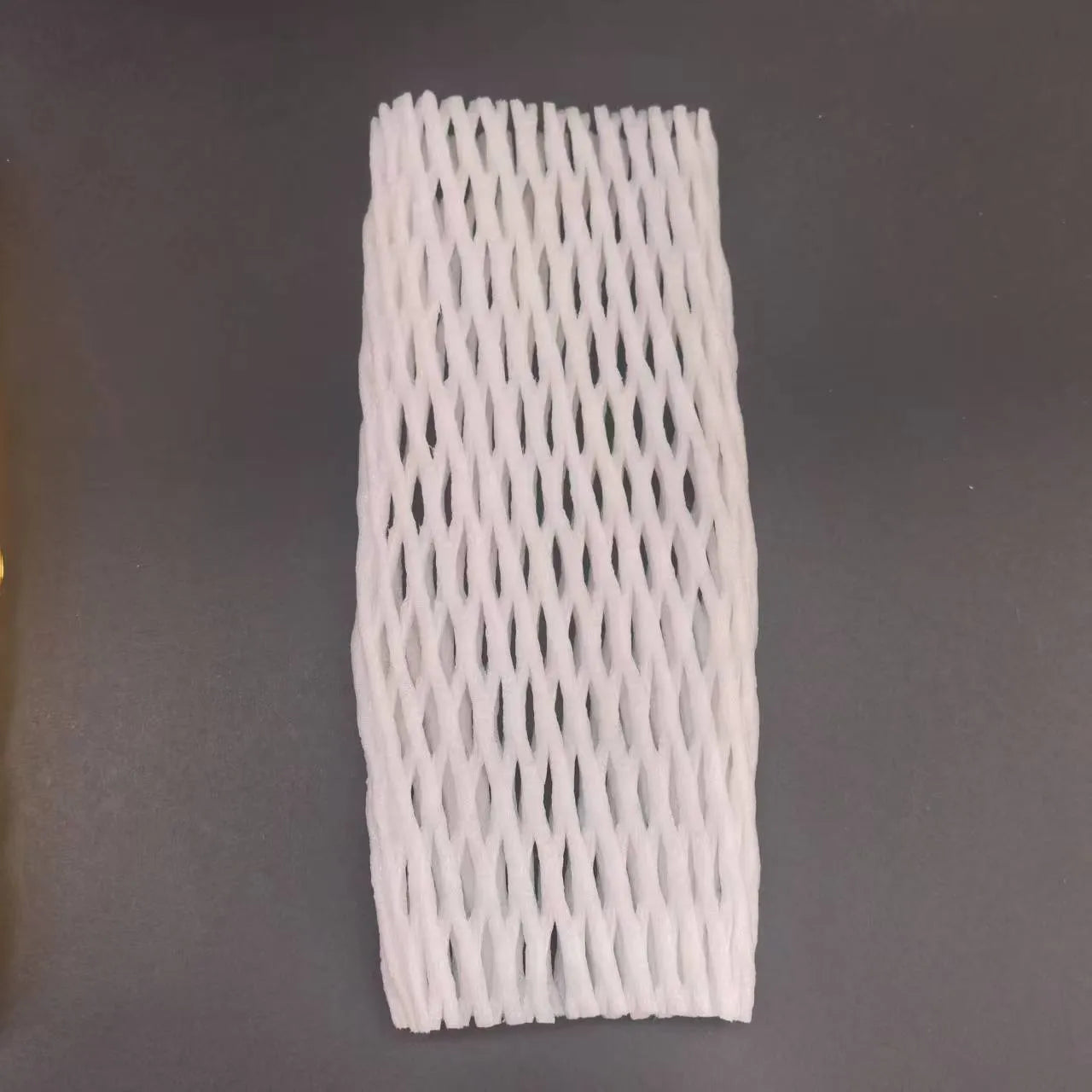 White foam protective net sleeve for fruit and delicate items, shown in multiple sizes.