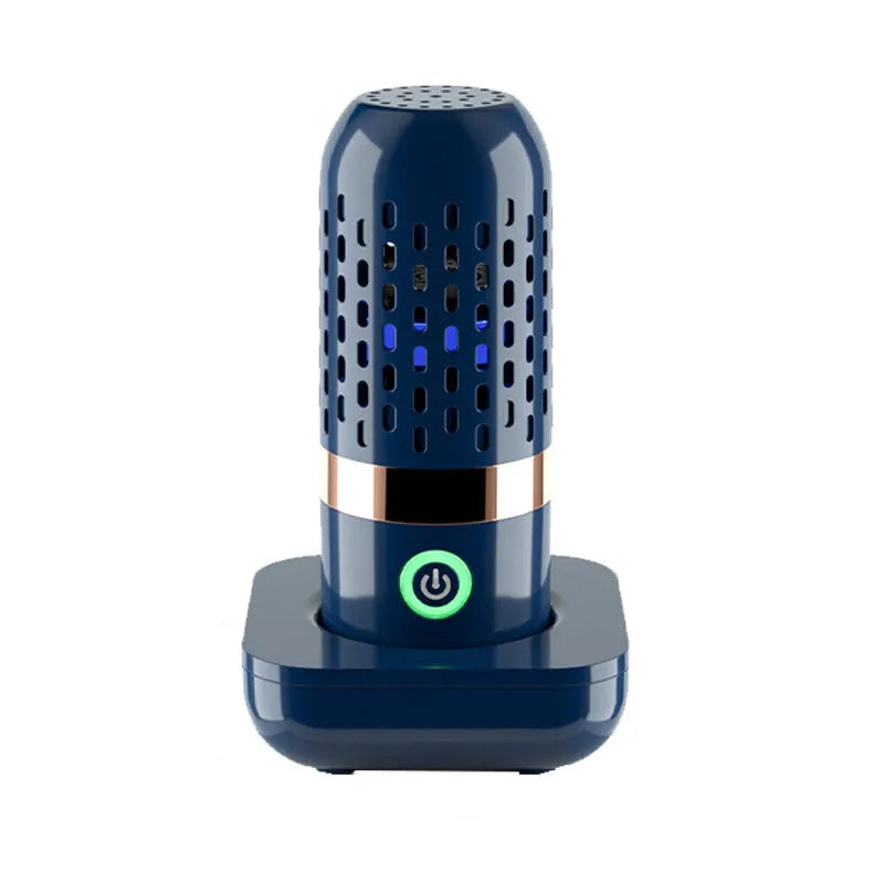 Blue capsule fruit and vegetable cleaner on a kitchen surface with USB charger