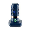 Blue capsule fruit and vegetable cleaner on a kitchen surface with USB charger