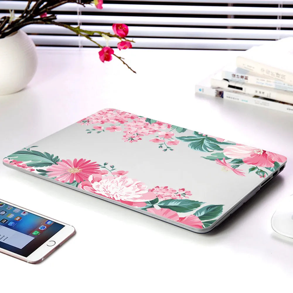 Plastic laptop protective shell with floral pattern for Apple MacBook Air and Pro models.