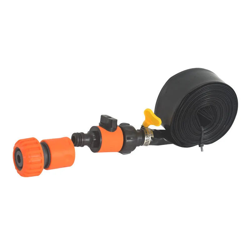 Blue portable garden sprinkler with PVC switch on a green lawn.