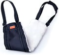Adjustable dog mobility sling supporting a dog's hindquarters with reflective nylon straps.