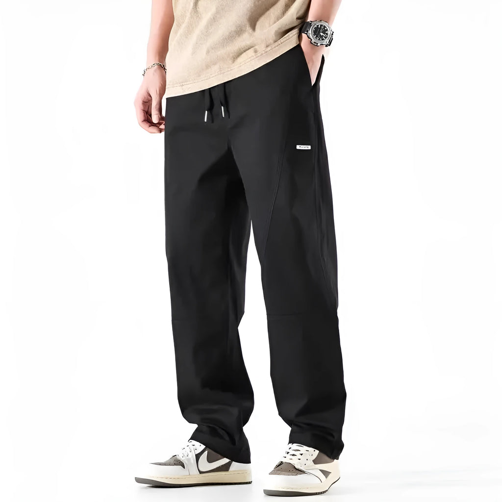 Women's milky white cotton wide-leg trousers with a straight pants-mouth opening, laid flat.