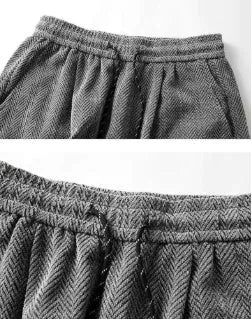 Straight-leg fleece-lined trousers in black, dark grey and light grey, showing elastic waistband.