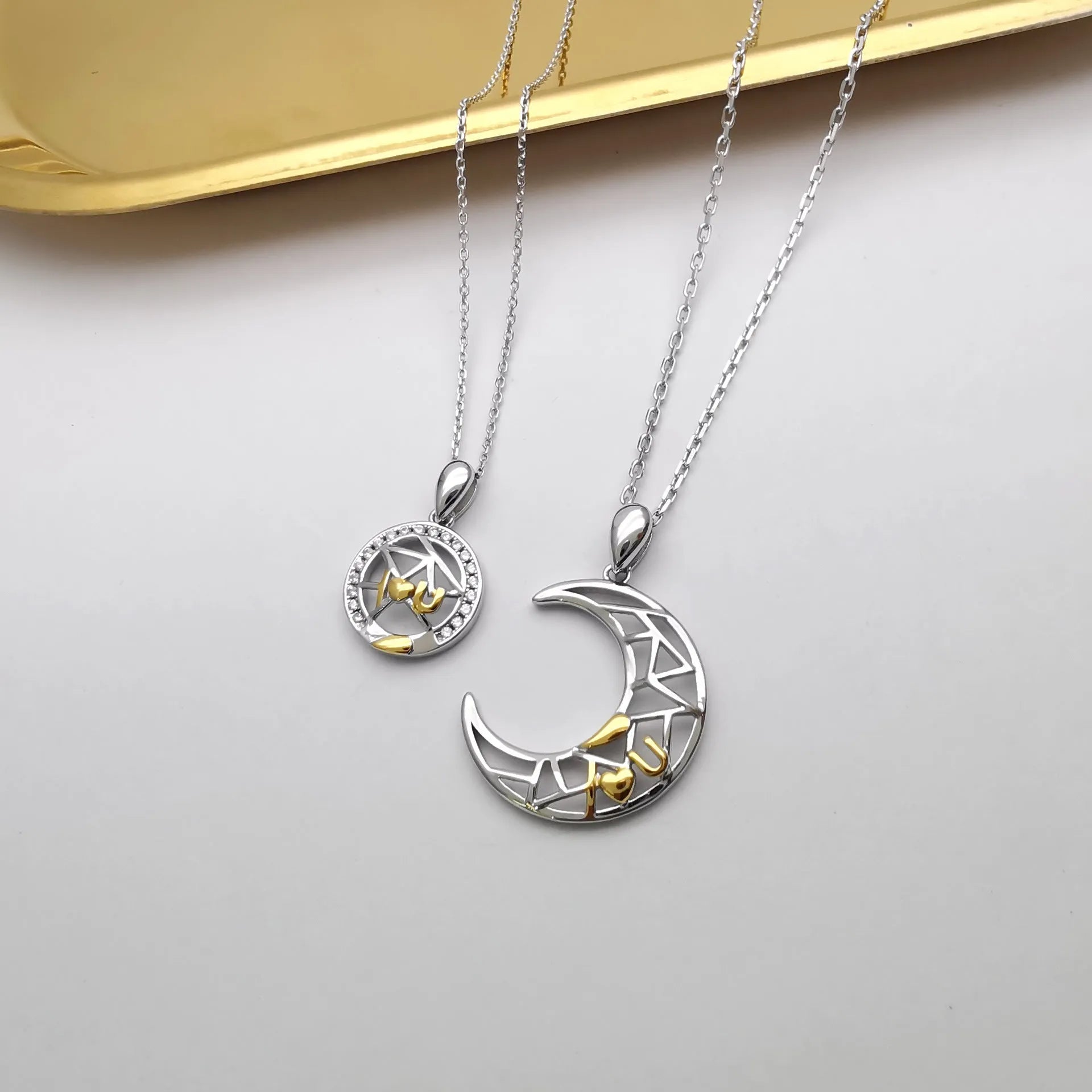 Sun and moon couple necklace with electroplated copper pendants on cross chain