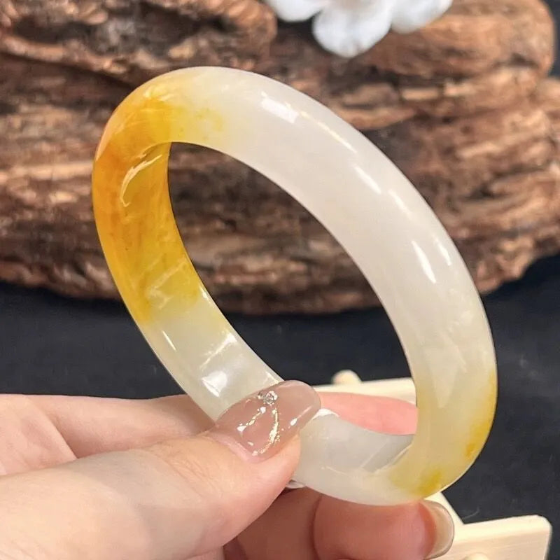 Geometric carved natural topaz bracelet with 12mm beads on white background