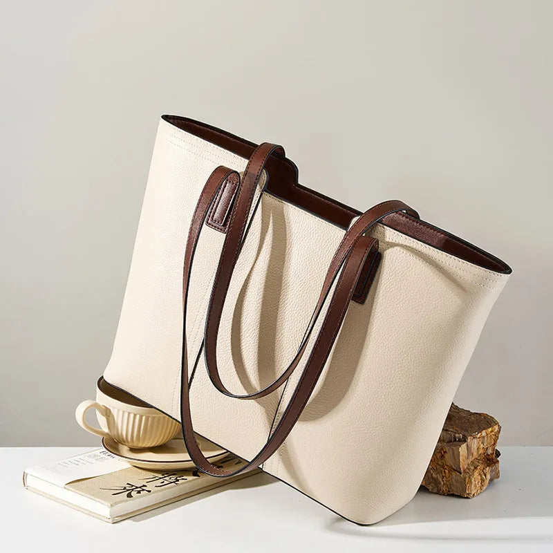 Black genuine leather women's commuter shoulder bag with horizontal square shape and single shoulder strap