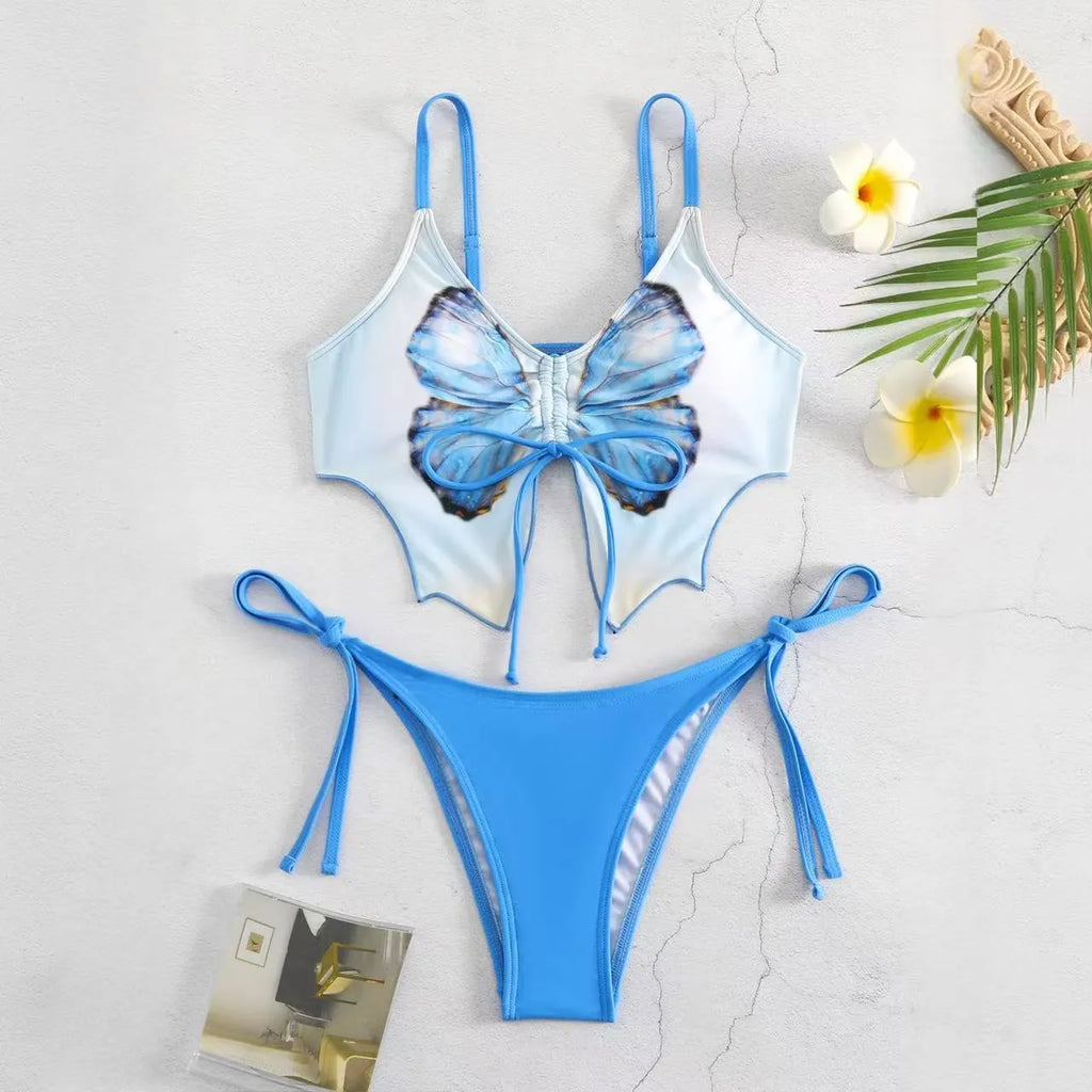 Purple women's bikini suit with bow detail and split design on a mannequin.